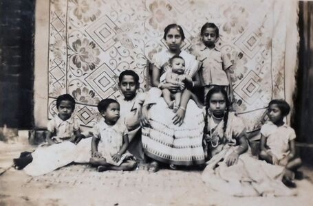 Adra. With her brothers and Sisters and my elder brother, Ashoke on her lap