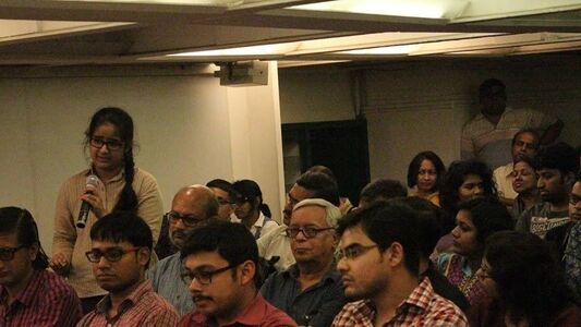 A young member of the audience asking questions.